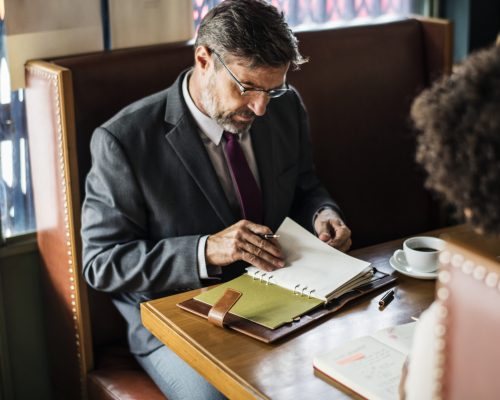Business people discussing in the cafe