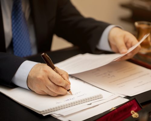 Businessman signing important contract papers. High quality photo